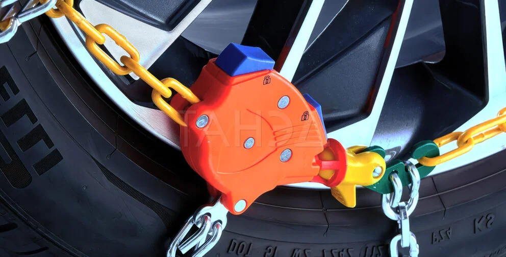 Система самонатяжения цепи